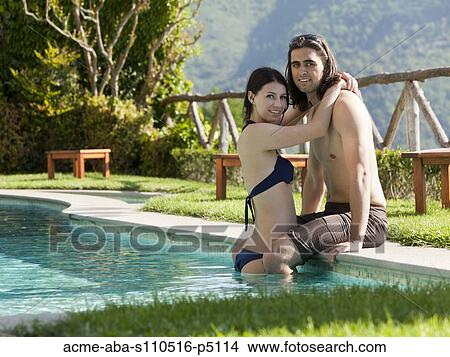 Italy, Ravello, Young couple embracing at swimming pool View Large Photo Image Picture - Italy, Ravello, Young couple embracing at swimming pool. Fotosearch