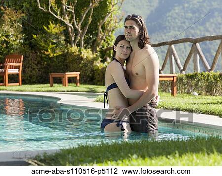 Italy, Ravello, Young couple embracing at swimming pool View Large Photo Image Stock Image - Italy, Ravello, Young couple embracing at swimming pool. Fotosearch