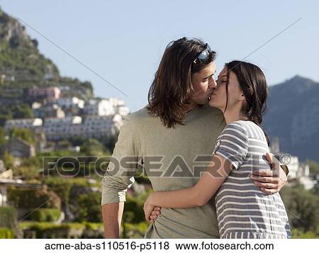 Stock Photo - Italy, Ravello, Young couple kissing. Fotosearch