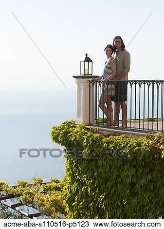 Italy, Ravello, Young couple standing together at balustrade View Large Photo Image Stock Image - Italy, Ravello, Young couple standing together at balustrade. Fotosearch