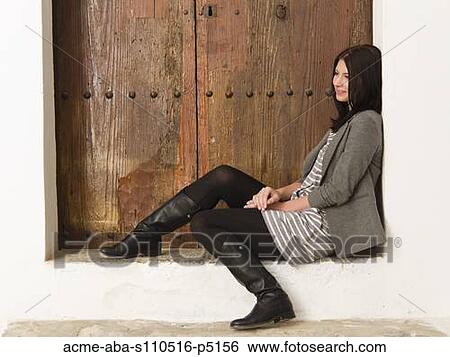 Italy, Ravello, Young woman sitting and looking away View Large Photo Image Stock Photograph - Italy, Ravello, Young woman sitting and looking away. Fotosearch
