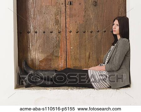 Italy, Ravello, Young woman sitting and looking away View Large Photo Image Stock Photography - Italy, Ravello, Young woman sitting and looking away. Fotosearch