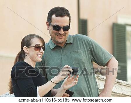 Italy, Rome, Spanish Steps, Couple watching pictures on camera View Large Photo Image Stock Photography - Italy, Rome, Spanish Steps, Couple watching pictures on camera. Fotosearch