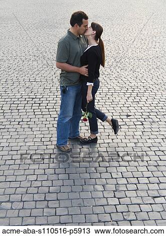Stock Image - Italy, Rome, Vatican City, Romantic couple kissing. Fotosearch