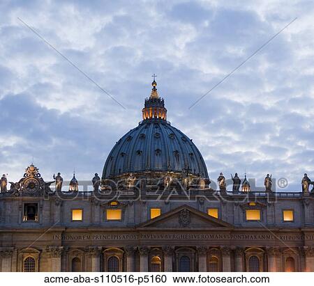 Stock Image - Italy, Rome, Vatican City, St. Peter's Basilica at dusk. Fotosearch