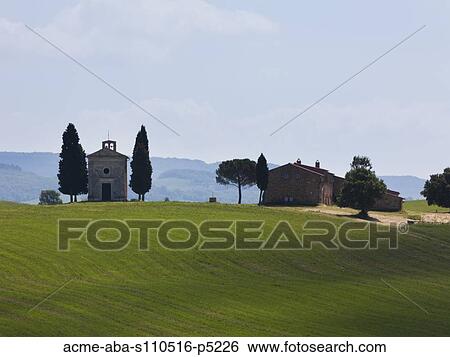 Italy, Tuscany, Buildings on field View Large Photo Image Stock Photograph - Italy, Tuscany, Buildings on field. Fotosearch
