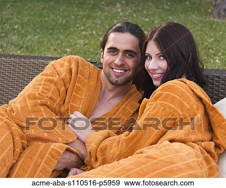 Italy, Tuscany, Portrait of young couple wearing bathrobe View Large Photo Image Stock Photo - Italy, Tuscany, Portrait of young couple wearing bathrobe. Fotosearch