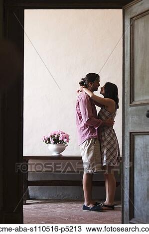 Italy, Tuscany, Young couple kissing in old house View Large Photo Image Stock Image - Italy, Tuscany, Young couple kissing in old house. Fotosearch