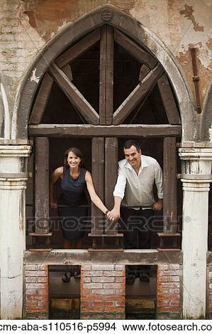 Italy, Venice, Couple standing in arcade View Large Photo Image Picture - Italy, Venice, Couple standing in arcade. Fotosearch