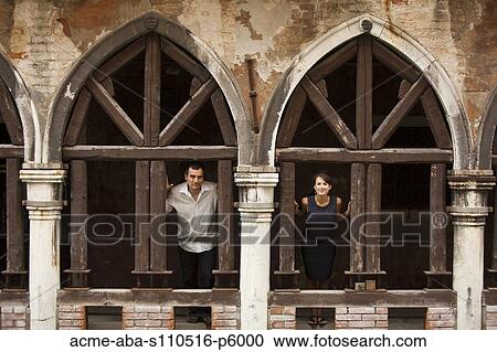Italy, Venice, Couple standing in arcade View Large Photo Image Stock Image - Italy, Venice, Couple standing in arcade. Fotosearch