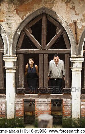 Italy, Venice, Couple standing in arcade View Large Photo Image Stock Photo - Italy, Venice, Couple standing in arcade. Fotosearch