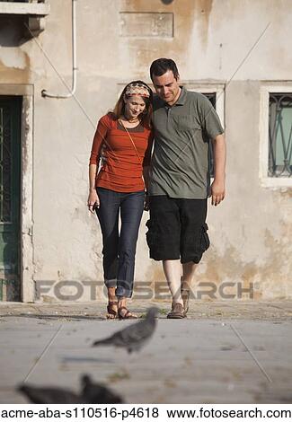 Italy, Venice, Couple walking in old town View Large Photo Image Stock Photo - Italy, Venice, Couple walking in old town. Fotosearch