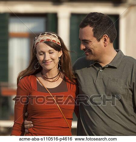 Italy, Venice, Couple walking in old town View Large Photo Image Stock Photograph - Italy, Venice, Couple walking in old town. Fotosearch