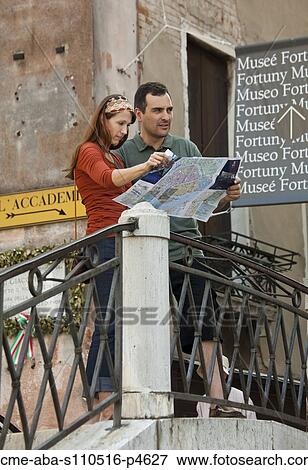 Italy, Venice, Couple with map, sightseeing in city View Large Photo Image Stock Photo - Italy, Venice, Couple with map, sightseeing in city. Fotosearch