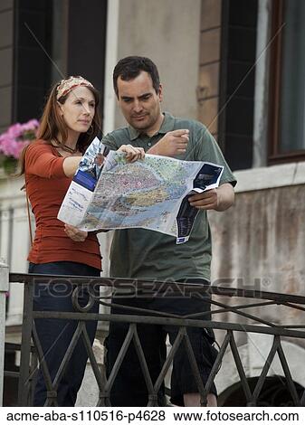 Italy, Venice, Couple with map, sightseeing in city View Large Photo Image Stock Photo - Italy, Venice, Couple with map, sightseeing in city. Fotosearch