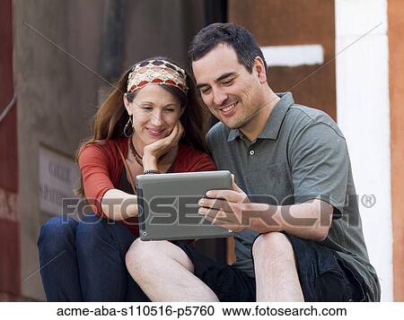 Italy, Venice, Mature couple using digital tablet View Large Photo Image Stock Image - Italy, Venice, Mature couple using digital tablet. Fotosearch