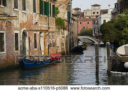 Italy, Venice, Scenic view on canal with rowboats View Large Photo Image Stock Photograph - Italy, Venice, Scenic view on canal with rowboats. Fotosearch