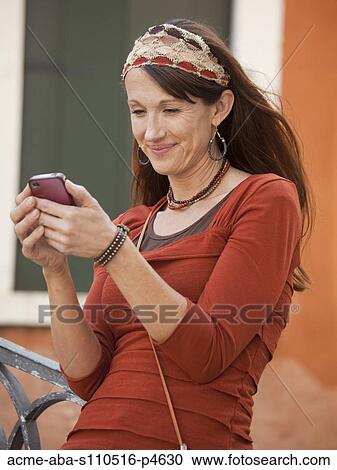 Italy, Venice, Woman text messaging using mobile phone View Large Photo Image Stock Image - Italy, Venice, Woman text messaging using mobile phone. Fotosearch