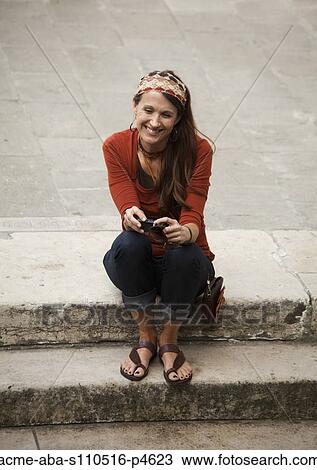 Italy, Venice, Woman viewing digital camera on steps View Large Photo Image Stock Image - Italy, Venice, Woman viewing digital camera on steps. Fotosearch