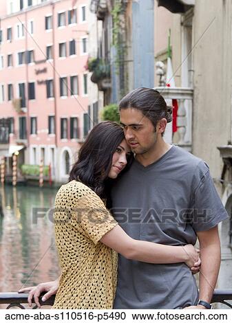 Italy, Venice, Young couple embracing by canal View Large Photo Image Stock Image - Italy, Venice, Young couple embracing by canal. Fotosearch