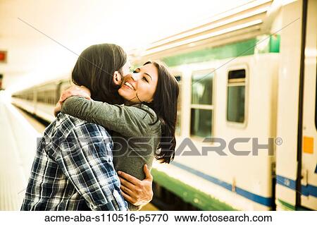 Italy, Venice, Young couple embracing on railway station View Large Photo Image Stock Image - Italy, Venice, Young couple embracing on railway station. Fotosearch