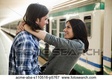 Italy, Venice, Young couple embracing on railway station View Large Photo Image Stock Photo - Italy, Venice, Young couple embracing on railway station. Fotosearch