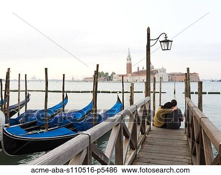 Italy, Venice, Young couple embracing by canal View Large Photo Image Stock Photograph - Italy, Venice, Young couple embracing by canal. Fotosearch