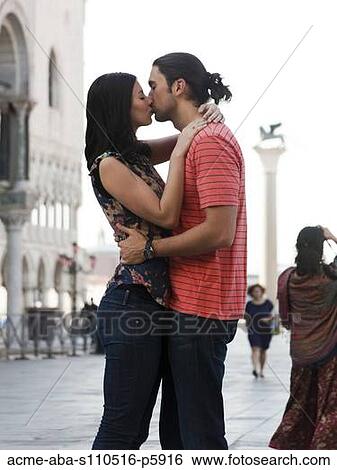 Italy, Venice, Young couple kissing on St. Mark's Square View Large Photo Image Stock Photograph - Italy, Venice, Young couple kissing on St. Mark's Square. Fotosearch