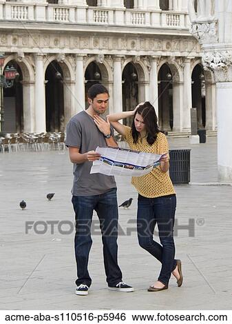 Italy, Venice, Young couple looking at map on St. Mark's Square View Large Photo Image Stock Photograph - Italy, Venice, Young couple looking at map on St. Mark's Square. Fotosearch