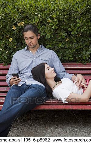 Italy, Venice, Young couple relaxing on bench View Large Photo Image Stock Image - Italy, Venice, Young couple relaxing on bench. Fotosearch