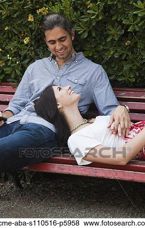 Italy, Venice, Young couple relaxing on bench View Large Photo Image Stock Photo - Italy, Venice, Young couple relaxing on bench. Fotosearch