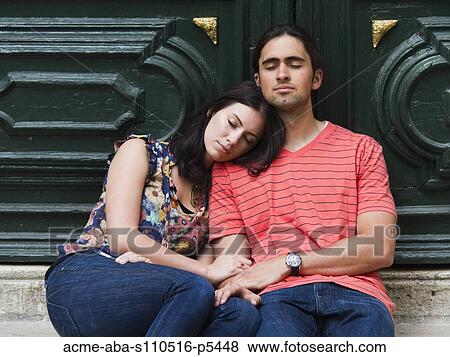 Italy, Venice, Young couple relaxing against green painted gate View Large Photo Image Stock Photo - Italy, Venice, Young couple relaxing against green painted gate. Fotosearch