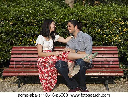Italy, Venice, Young couple sitting on bench View Large Photo Image Stock Photo - Italy, Venice, Young couple sitting on bench. Fotosearch