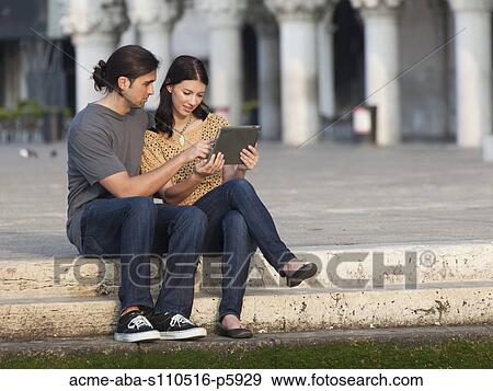 Italy, Venice, Young couple using digital tablet on St. Mark's Square View Large Photo Image Stock Photo - Italy, Venice, Young couple using digital tablet on St. Mark's Square. Fotosearch