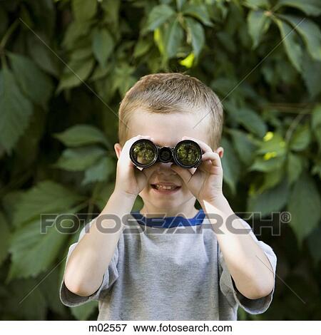 little boy looking through binoculars View Large Photo Image Stock Photo - little boy looking through binoculars. Fotosearch