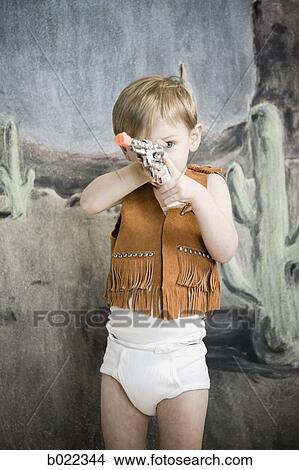 little boy pretending to be cowboy View Large Photo Image Picture - little boy pretending to be cowboy. Fotosearch