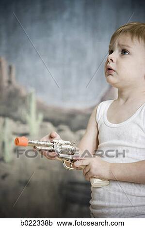 little boy pretending to be cowboy View Large Photo Image Stock Image - little boy pretending to be cowboy. Fotosearch