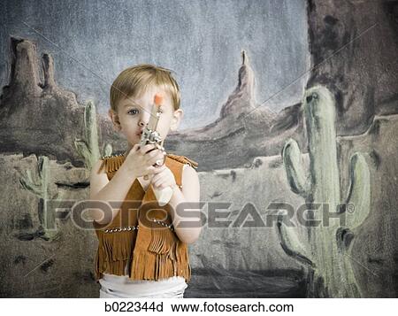 little boy pretending to be cowboy View Large Photo Image Stock Image - little boy pretending to be cowboy. Fotosearch