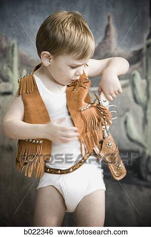little boy pretending to be cowboy View Large Photo Image Stock Photograph - little boy pretending to be cowboy. Fotosearch