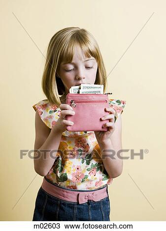 little girl putting money in her pink wallet View Large Photo Image Stock Image - little girl putting money in her pink wallet. Fotosearch