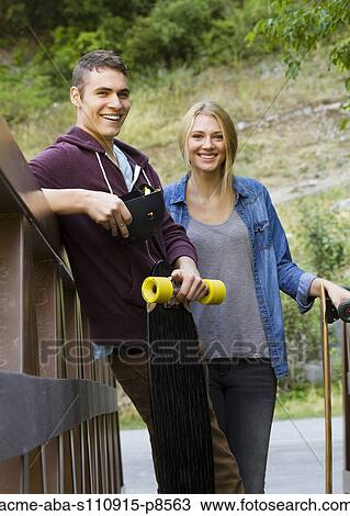 Long boarding couple View Large Photo Image Stock Image - Long boarding couple. Fotosearch