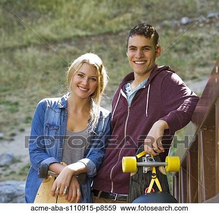 Stock Photo - Long boarding couple. Fotosearch