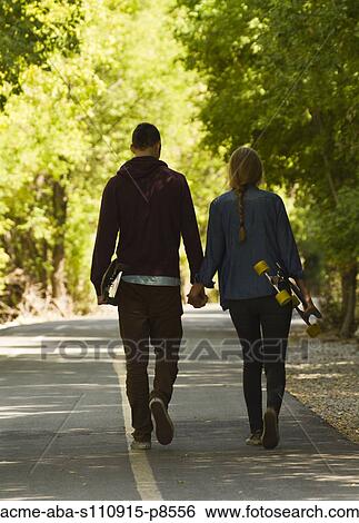 Long boarding couple View Large Photo Image Stock Photograph - Long boarding couple. Fotosearch
