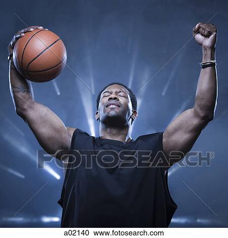 Male basketball player holding ball, studio shot View Large Photo Image Stock Image - Male basketball player holding ball, studio shot. Fotosearch