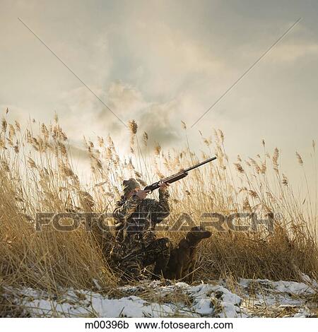 man and his dog duck hunting View Large Photo Image Stock Image - man and his dog duck hunting. Fotosearch