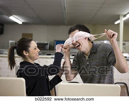 man and woman at a laundromat View Large Photo Image Stock Image - man and woman at a laundromat. Fotosearch