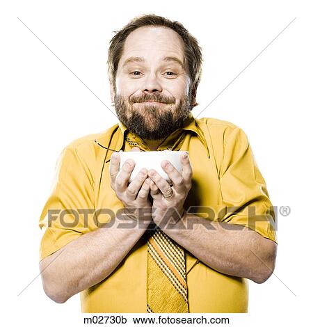 Stock Image - man holding a bowl of cereal. Fotosearch