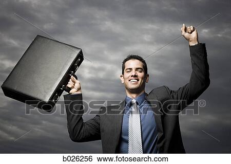 man holding a briefcase View Large Photo Image Stock Photograph - man holding a briefcase. Fotosearch