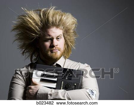 man holding a keyboard View Large Photo Image Stock Image - man holding a keyboard. Fotosearch