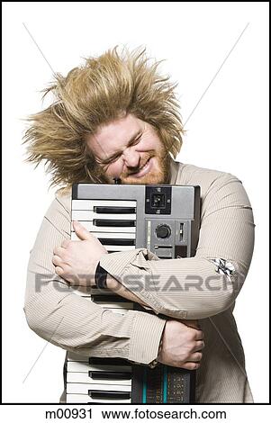man holding a keyboard View Large Photo Image Stock Image - man holding a keyboard. Fotosearch
